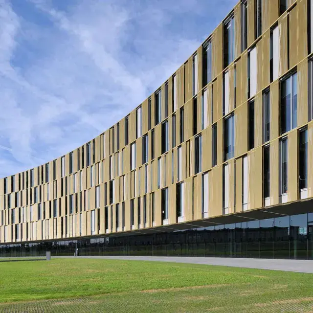 Golden sun shades in the curved façade