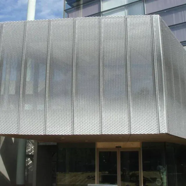 Facade with expanded metal sunshade panels